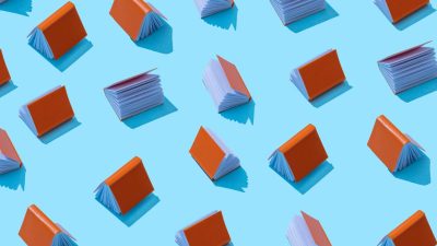 Stack of diverse books showcasing various genres and authors, illustrating the articles focus on literary diversity and tr...