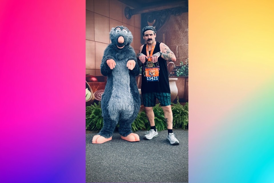 Runners crossing the finish line at Disney Marathon 2023, showcasing determination and celebration in vibrant costumes.