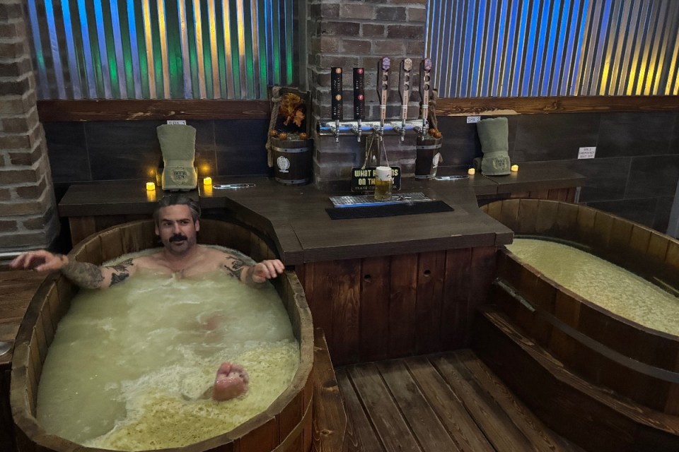 Runners in colorful costumes race through Disney theme park during annual marathon event.