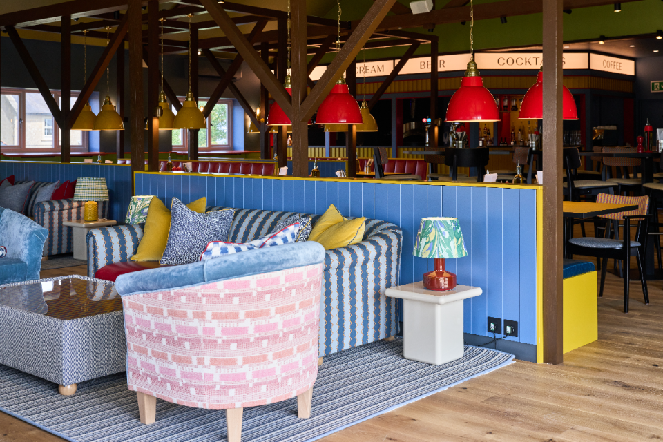 Business professionals engaged in a meeting, discussing strategies, with charts and graphs displayed on a conference room ...