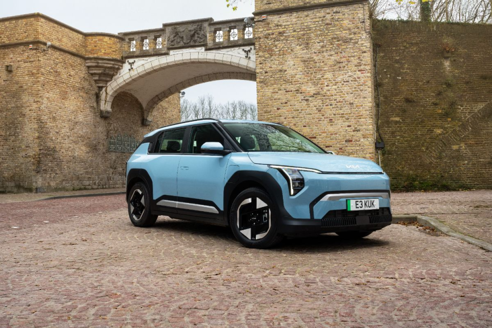 General news image featuring diverse individuals engaged in a lively discussion at a business meeting setting.