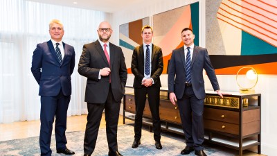 Craig Harrison, Ruben Sinha, Joe Cobb, and Thomas Pearson standing together, likely in a business or news-related setting.