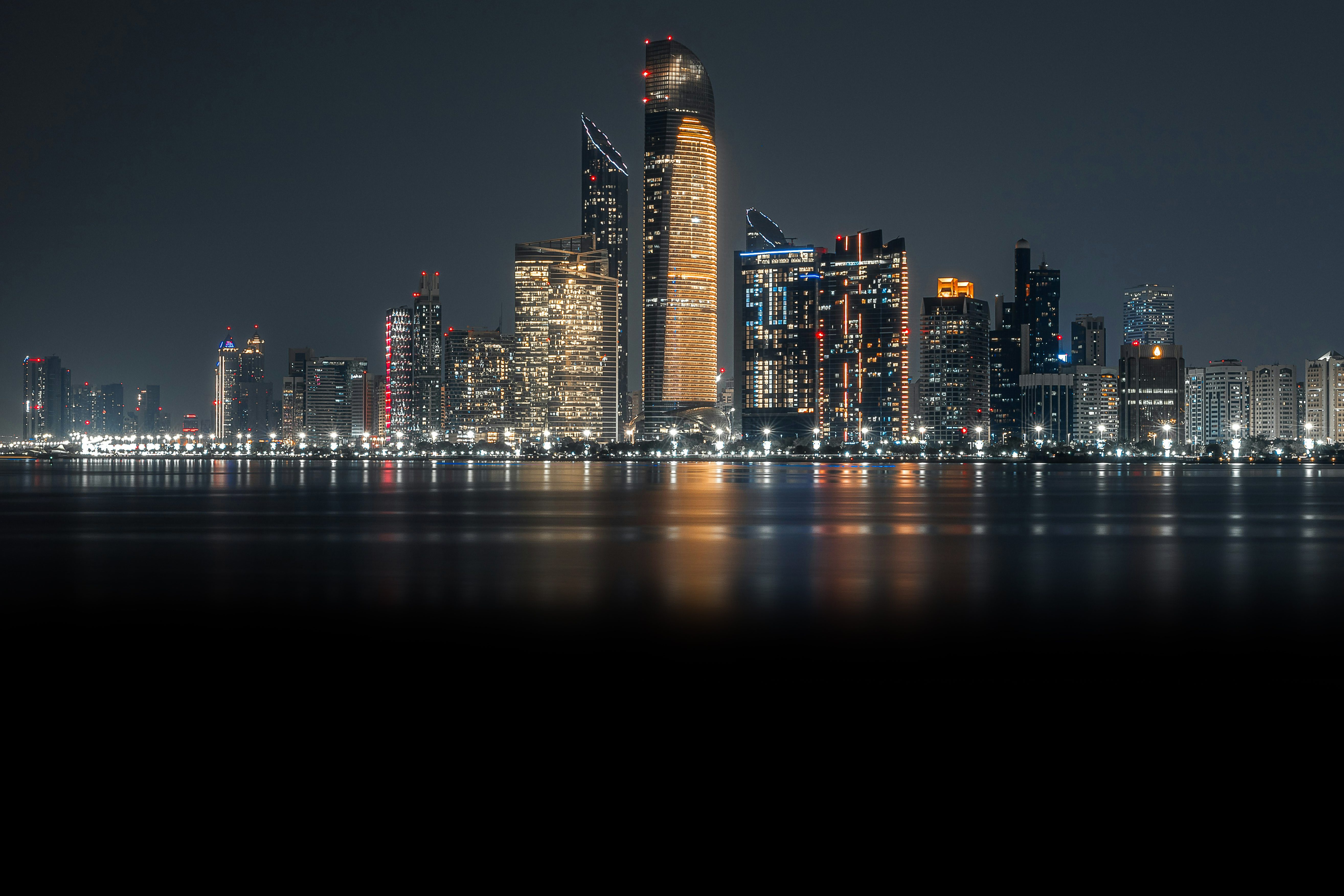 Leon Macapagal capturing a vibrant cityscape at sunset, highlighting urban life and architecture for a news article.