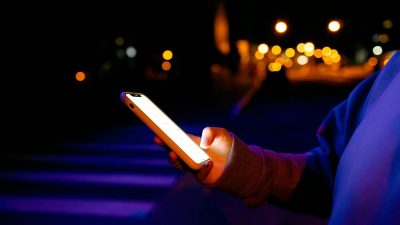 Maks Gelatin capturing a busy urban street scene with bustling pedestrians and vibrant city life, perfect for a news artic...