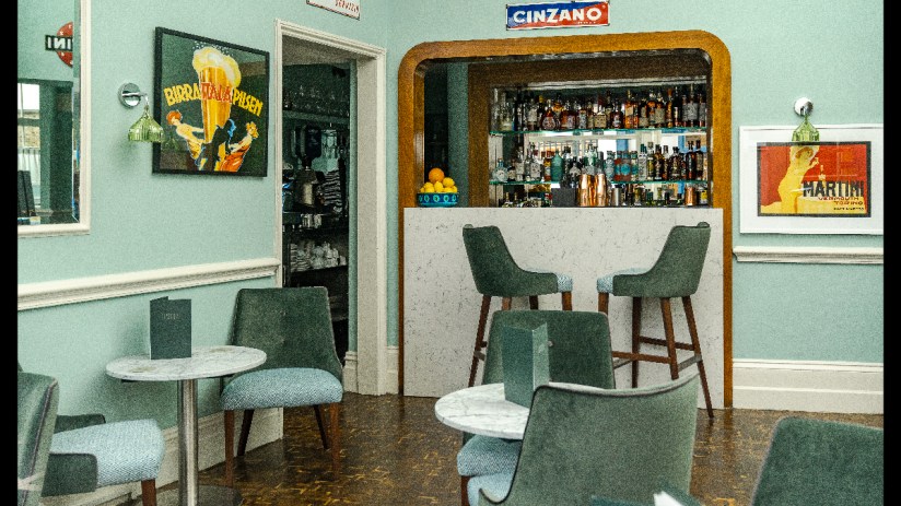 Sartoria Launcetoun storefront showcasing elegant tailoring and bespoke suits in a stylish urban setting