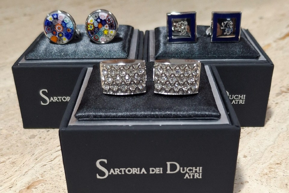 Tailored suit display at Sartoria, showcasing refined craftsmanship and elegant fabric choices in a sophisticated setting