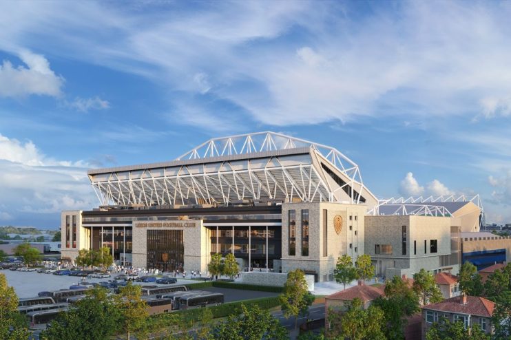 Southwest corner view showcasing modern architectural design with glass facades and bustling city street in daylight.