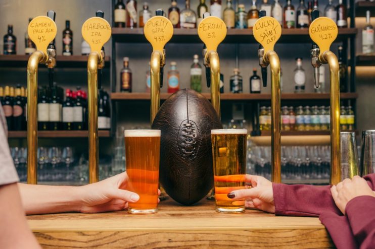 General news image featuring diverse group of people at a business meeting discussing current events and industry trends