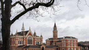 Dulwich College London historic main building with lush green grounds, highlighting prestigious private school setting