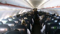 EasyJet cabin interior showcasing seating arrangement and overhead compartments during a flight.