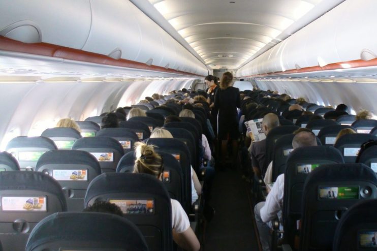 EasyJet cabin interior showcasing seating arrangement and overhead compartments during a flight.