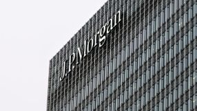 GettyImages 1927388065 featuring a business meeting with diverse professionals discussing corporate strategies in a modern...