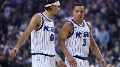 GettyImages 2256933277 showing a professional business meeting with diverse team members discussing strategy in a modern o...