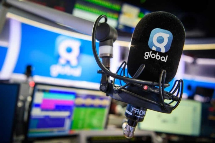 Global microphone symbolizing international communication and connectivity on a business news backdrop