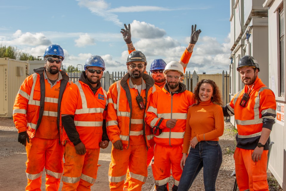 HSS Avonmouth team members collaborating on a project in an industrial setting, showcasing teamwork and safety compliance.
