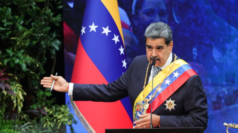 Nicol&aacute;s Maduro speaking at a press conference in Venezuela, discussing political and economic issues in the country.