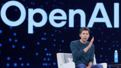 Sam Altman discussing OpenAIs ChatGPT advancements at a press conference, emphasizing AI innovation and future developments
