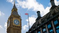 Westminster Parliament building under a cloudy sky, showcasing iconic architecture and historic significance in central Lo...
