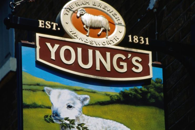Youngs pub bustling with patrons enjoying drinks, cozy interior, and lively atmosphere in a popular neighborhood setting