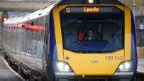 Northern Powerhouse Rail train arriving at Leeds station showcasing modern transportation infrastructure.