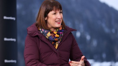 Rachel Reeves speaking at Davos WEF, discussing Labours economic policies amidst global leaders and business executives.