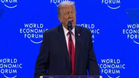 Donald Trump speaking at the World Economic Forum in Davos, addressing global leaders on economic policies and internation...