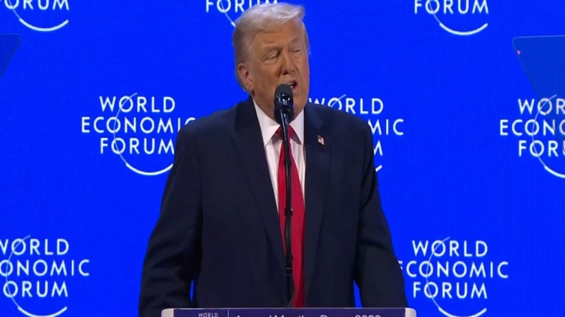 Donald Trump speaking at the World Economic Forum in Davos, addressing global leaders on economic policies and internation...