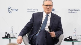 News article image depicting a general business meeting with diverse professionals discussing strategies in a modern offic...