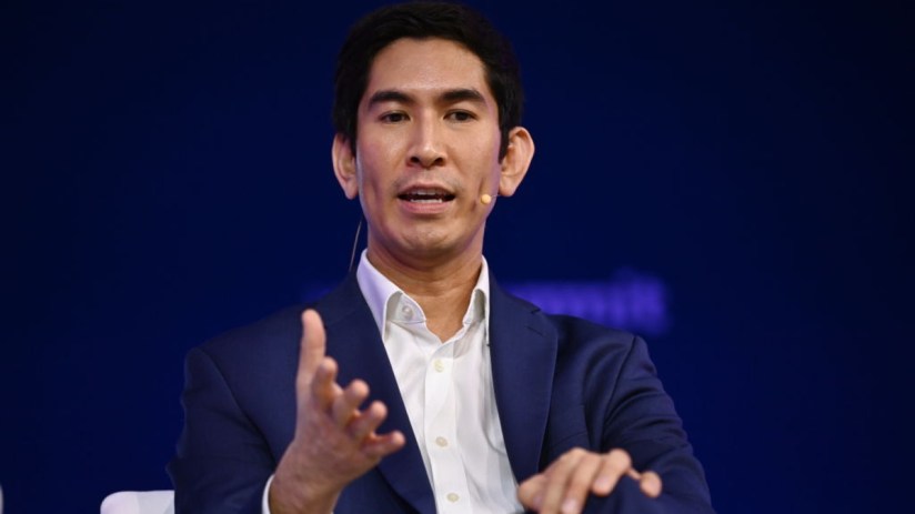 Dex Hunter Torricke, AI executive, speaking at a business conference, addressing AI advancements and industry trends.