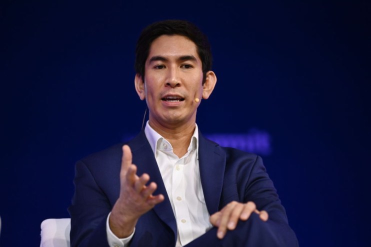 Dex Hunter Torricke, AI executive, speaking at a business conference, addressing AI advancements and industry trends.