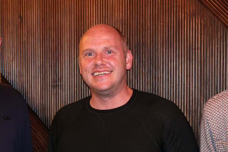 Adobe Express interface showcasing design tools and features for creative projects on a business news website