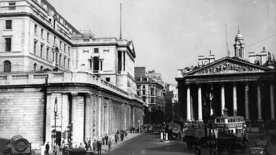 Bank of England building exterior with historic architecture under clear sky, representing Britains financial stability