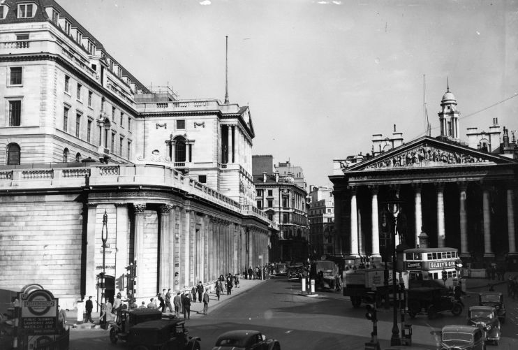 Bank of England building exterior with historic architecture under clear sky, representing Britains financial stability