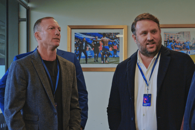 Urban skyline at sunrise with skyscrapers in silhouette, highlighting morning activity in a bustling financial district.