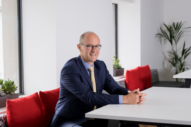 David Sleath, Chief Executive Officer, in a business setting, conveying leadership and professionalism.