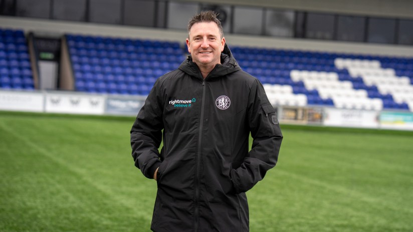 Breaking news event with officials addressing the media, showcasing diverse reactions and attentive audience in a conferen...