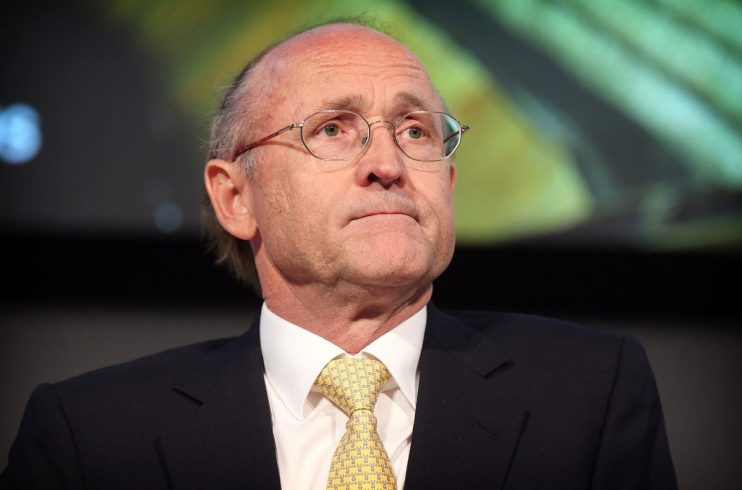 GettyImages 112179442 depicts a business meeting with diverse professionals discussing strategies at a modern conference r...