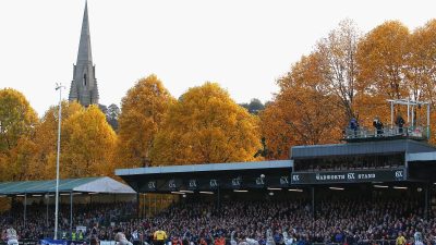GettyImages 131517629: Business professionals in a meeting, discussing strategies, with charts and laptops, in a modern of...