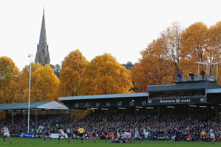 GettyImages 131517629: Business professionals in a meeting, discussing strategies, with charts and laptops, in a modern of...