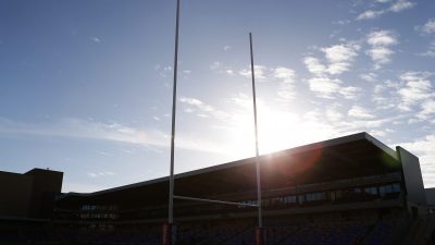 Business professionals engaged in a meeting, discussing strategies and analyzing data, in a modern corporate office setting.