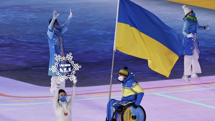 Diverse business team in a meeting, discussing strategies with charts and laptops on a conference table in a modern office