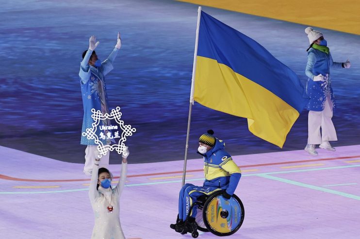 Diverse business team in a meeting, discussing strategies with charts and laptops on a conference table in a modern office