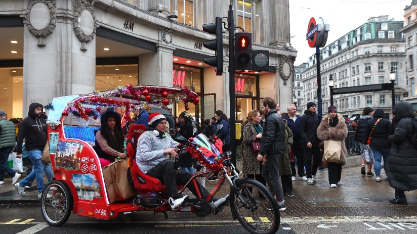 GettyImages 2190272016: Business professionals in a meeting discussing strategic plans and market trends in a modern offic...