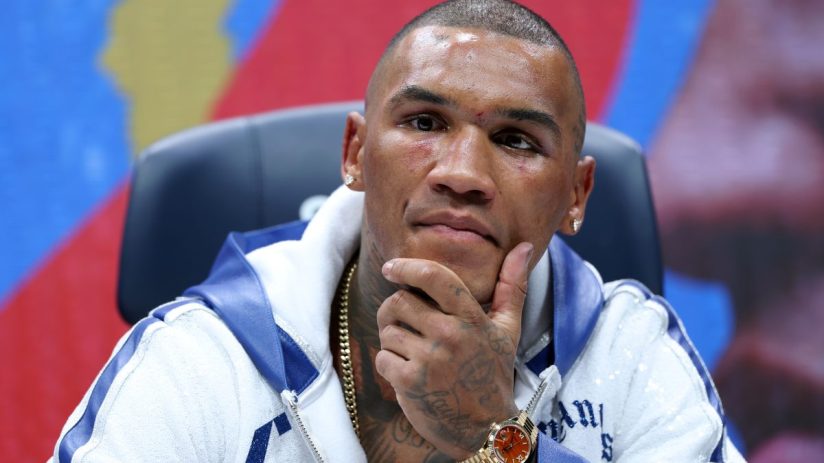 Business professionals engage in a lively discussion at a corporate meeting, highlighting teamwork and leadership skills.