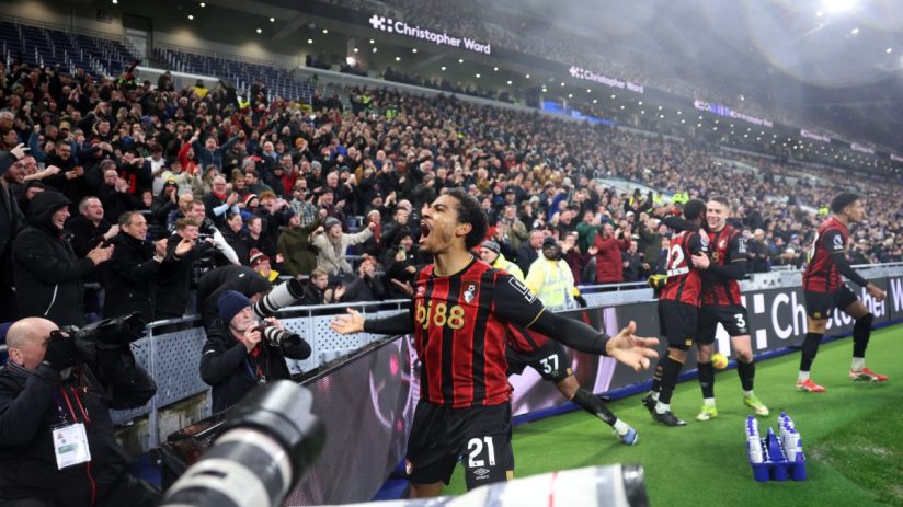 GettyImages 2260950583 showing a business meeting with diverse professionals discussing strategies in a modern office setting