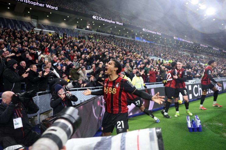 GettyImages 2260950583 showing a business meeting with diverse professionals discussing strategies in a modern office setting
