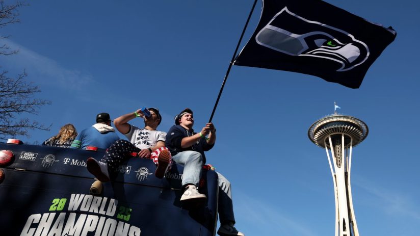 Getty Images logo displayed on a smartphone screen against a background of digital data, representing media and technology...