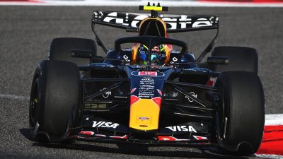 GettyImages 2261425635 showcasing a business meeting with diverse professionals discussing market trends and strategies.