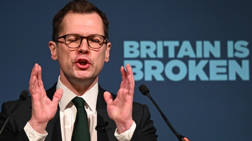 Getty Images logo on a smartphone screen with a blurred cityscape background, symbolizing digital media and photography news.