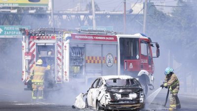 Business professionals discussing financial strategies at a conference table with charts and graphs in a modern office set...